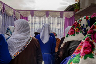 Villagers come to view a replica bedroom, filled with wedding gifts, built outside a bride's family home by her relatives and close friends. The room, aping the real one inside, is filled with wedding...