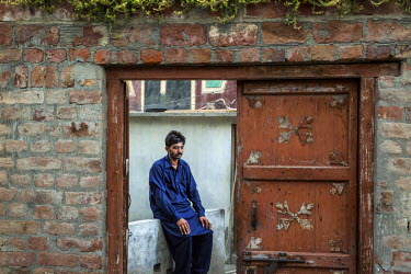 Ghulum Murtaza (30) sits alone at his family home. Ghulum suffers from bilateral cataracts and was forced to leave his job in Saudi Arabia and return home because of his poor vision. He is no longer c...
