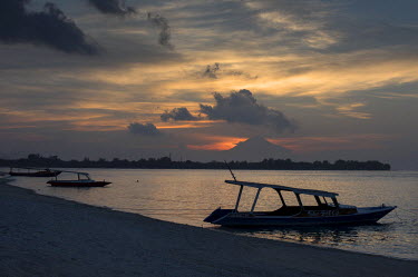 Mount Agung, an active volcano on Bali, seen in the distance at sunset from Gili Meno Island.