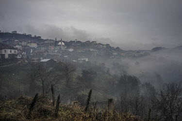 Mist rises around the village of Ribnovo, as seen from the graveyard on the opposite side of the valley.