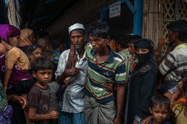 Jamal Hossen (22) a Rohingya refugee is helped into an 'Action Centre Le Faim' (ACF) feeding centre near a refugee camp in Kutupalong. Jamal had not eaten in three days and spent the past four days wa...