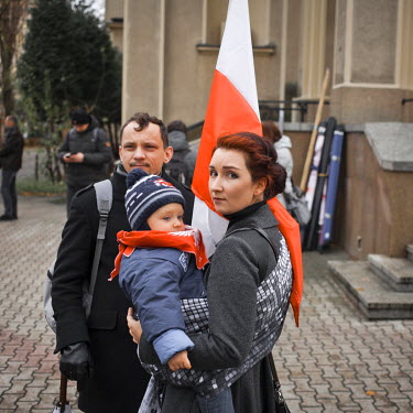 A family, who support the PiS government, at a rally on Independence Day which was attended by a mixed crowd of moderate right wing government supporters, as well as those with strong anti-European an...