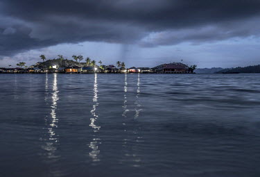 Stilt houses in the Bajau village of Pulo Papan in the Togean Islands, as a thunder storm rolls in.