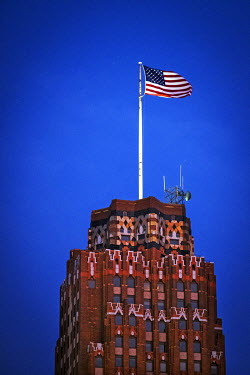 A Stars and Stripes flag flies from the top of the Guardian Building, a skyscraper in downtown Detroit.