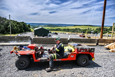 A miner in a specialist vehicle.