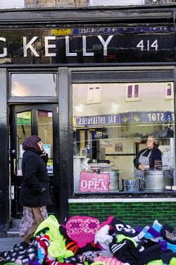 Teresa Wakeham looks out a window at GF Kelly, a pie and mash shop on the Bethnal Green Road.