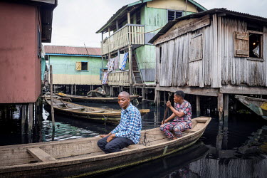 Hosea Sosu, a practitioner of traditional medicine, makes a home visits by boat on the Makoko waterfront, a slum area consisting of wooden buildings on stilts erected on a lagoon where he also lives a...