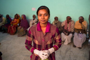 Julie, an ophalmic nurse standing in front of her patients at the Laxman Hospital.