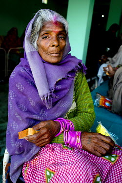 A patient waits to have eye surgery at the Laxman Hospital.