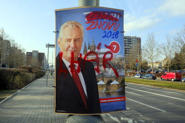 A defaced election poster, where someone has sprayed the word 'Liar', of Czech president Milos Zeman who is running for second term.