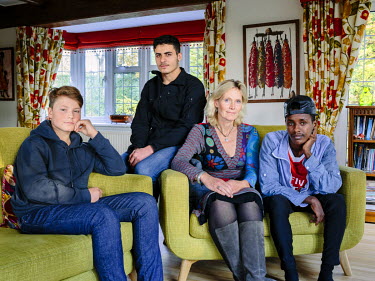 Ingrid Van Loo Plowman, a volunteer and former doctor, and her youngest son Ross, host three refugees in their home in Epsom, near London: Isak (18) from Ethiopia, Abdul (19), from Syria and a 31 year...