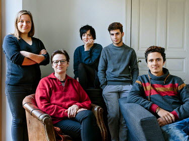 Sabine Waldner with her daughters, Charlotte and Miriam, host two Syrian refugees, Juan (16) and Mohammed (16), classmates from Damascus, at their home in Falkensee.Charlotte says: ^It's amazing how c...