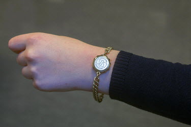 A bracelet containing vital medical information is worn by a woman with diabetes. In cases where the patient may not be able to communicate, this allows for medical personnel to quickly find details a...