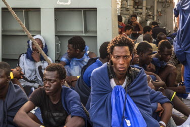 Migrants, mostly from Sub-Saharan Africa, on board the Spanish navy vessel the Cantabria as it sails into Palermo. The migrants were rescued from a small boat as it attempted the dangerous crossing of...