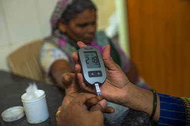 A patient gets their blood glucose levels checked at the Kamala Raman Nagar dispensary which runs a dedicated diabetes check up clinic.
