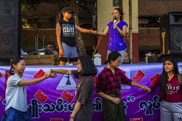 Members of Myanmar Women's Self Defence Centre demonstrate self-defense moves at an 'edutainment' event about violence against women, which is part of the 'Women's Desire Campaign' organised by domest...