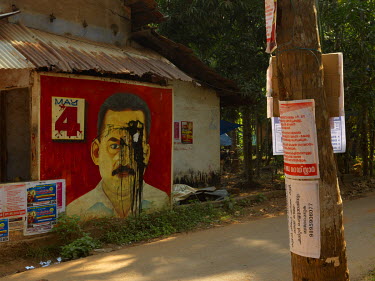 A defaced mural outside the RMP (Revolutionary Marxist Party) Bank Branch Office (Local Committee Office).