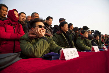 Judges watch the storyteller's performances at the Ma Jie folk festival. For centuries farmers in Henan have gathered during Chinese New Year in the region's wheat fields to listen to bards singing an...