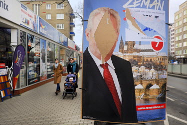 A defaced election poster of Czech president Milos Zeman who is running for a second term.
