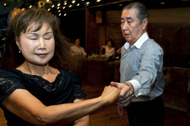 An elderly couple dancing at the Bonsowaaru (bonsoir) club in Machiya.