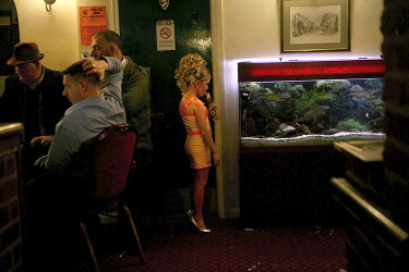 Savannah Sheridan looks into a fish-tank in the Duke of York pub. The pub was visited almost exclusively by Irish Travellers living on a site nearby. After the Travellers were evicted the lack of cust...