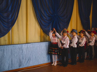 Children perform national dances during a concert on Teacher's Day, an annual appreciation of educators .