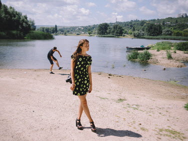 Katerine and Alexander during a walk along a river bank.