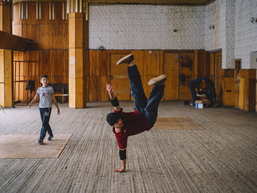 A man performs a move during a break dance class in the town's House of Culture.
