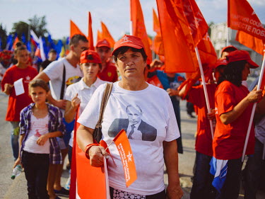 A woman with a picture of Valimir Putin on her t-shirt during a Socialist Party rally in the city centre.