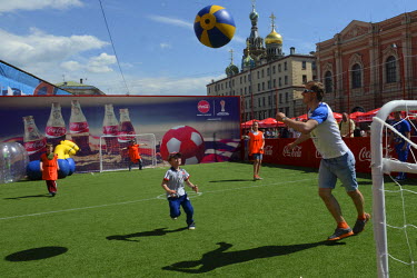Children play football in a Fan Zone in the city centre during the 2017 Confederation's Cup.