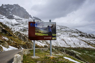 A billboard advertisement on the route up to the Furka Pass from the Reuiss Valley in Uri Canton, just after it opened after a seven month winter closure.