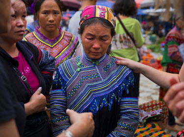 A woman comes forward at Bac Ha Market to tell Suong, an activist against people trafficking, of her own experience, her daughter has been missing for a year thought to be kidnapped and taken over the...