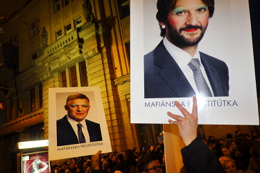 Protesters hold images of Protesters hold posters of Robert Fico (Prime Minister) and  Robert Kalinak ( Minister of the Interior) at a rally under the slogan 'Postavme sa za slusne Slovensko' (Let's s...