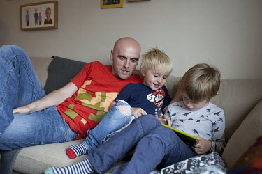 Simon Wheatcroft, a blind marathon runner, with his sons at his home in Doncaster.