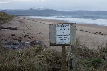 A sign for a community shop on the beach in Embo near Dornoch in northern Scotland.