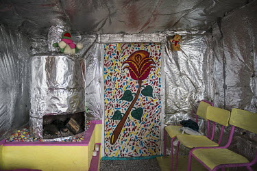 A room in a makeshift shelter in the so-called 'Jungle' refugee camp designed to keep in as much warmth as possible.