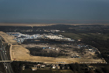 An overview of the so-called 'Jungle' refugee camp shortly after the southern part of the camp (seen at the bottom of the picture) was demolished by the authorities.