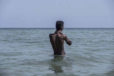 Youths enjoy the warm waters of the Guld of Aden at a beach in Berbera.