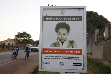 A roadside posterpromoting family planning.
