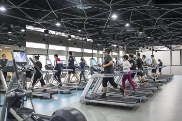 Employees uses the gym during lunch hours at JD.com's headquarters in Beijing.