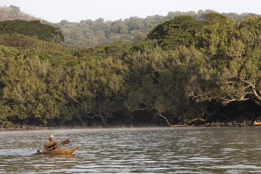 A fisherman in papyrus boat paddles off the shore of Zege, a forested part of the mainland around Lake Tana, containing numerous churches and monastic sites.