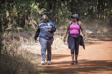 A couple take a brisk walk in the Karura Forest.