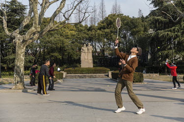 Pensioners play badminton in Fuxin Park.