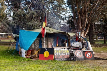 The Aboriginal Tent Embassy, a semi-permanent assemblage where residing activists claim to represent the political rights of Aboriginal Australians. It is made up of signs and tents on the lawn opposi...