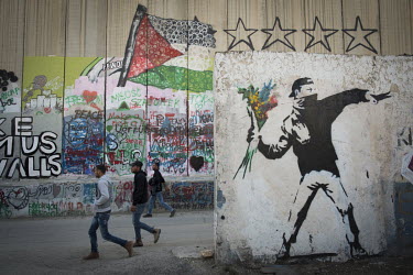 A mural by Banksy beside the separation (security) wall separating the West Bank from Israel.
