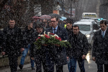 President of Serbia Aleksandar Vucic arrives to lay a wreath at the spot where opposition leader Oliver Ivanovic was shot dead in the street.