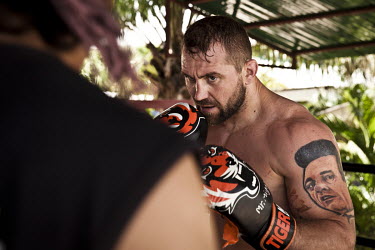 Alan Belcher, an American mixed martial artist figther, training at the legendary Tiger gym on Soi Tad, or 'Gym Road', a single three kilometre stretch of asphalt that is home to several MMA training...