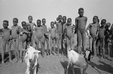 Children in a remote Nuer cattle camp by the Baro River not far from the Sudanese border. Their bodies are stained grey by an ash mixture rubbed into their bodies as protection from biting flies.