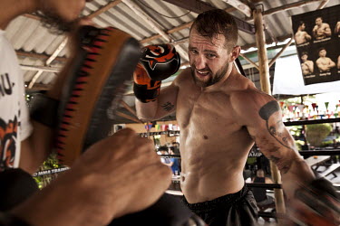 Alan Belcher, an American mixed martial artist figther, training at the legendary Tiger gym on Soi Tad, or 'Gym Road', a single three kilometre stretch of asphalt that is home to several MMA training...