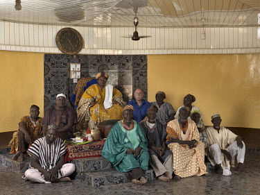 Kasulilana Alhaji Yakubu Bukari (dob June 4, 1952), from the Abudu family, a Dagomba chief (Kasuliyili Naa) with members of his court and photographer Jan Banning.      The Sweating Subject is a small...